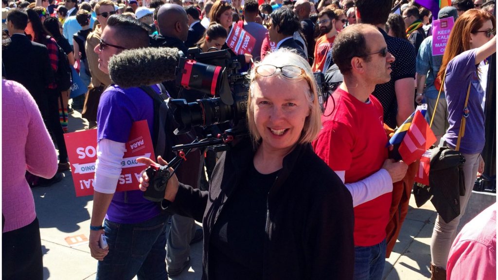 DP Claudia Raschke in front of the supreme court in DC surrounded by protesters and activists. Photo by Eddie Rosenberg